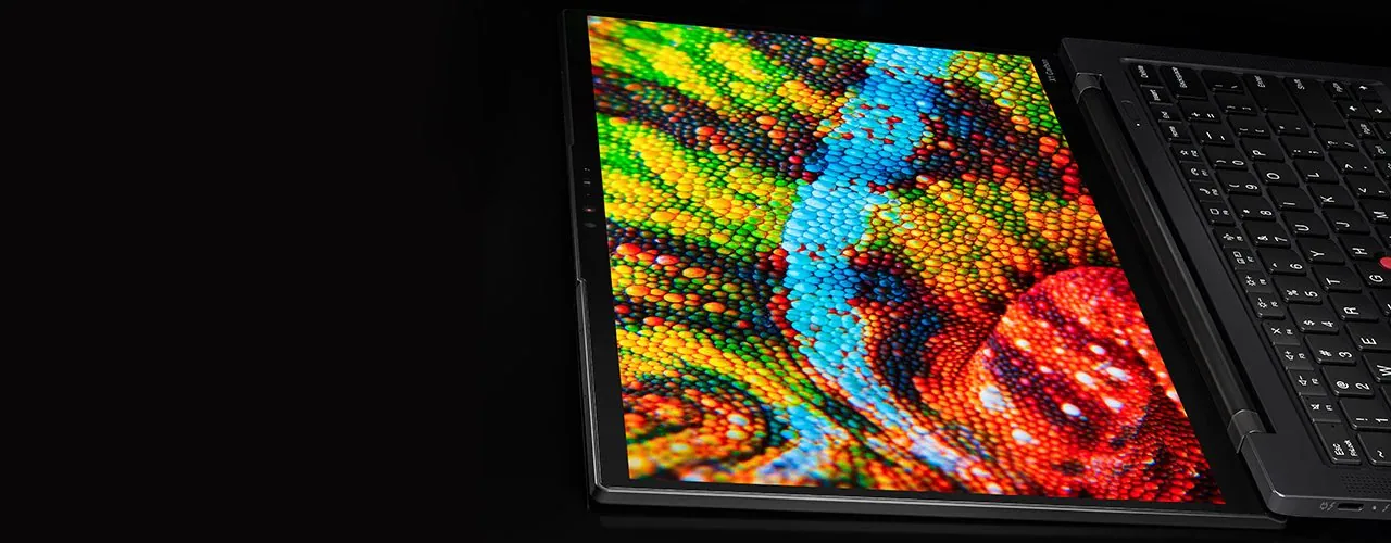 A Lenovo ThinkPad X1 Carbon laptop display showing a vibrant mosaic of multicolored circles